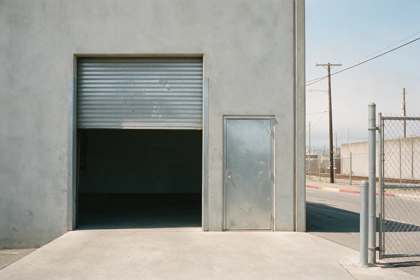 The Roll-Up and the Man-Door: What Each One on a Davis Street Building Actually Needs