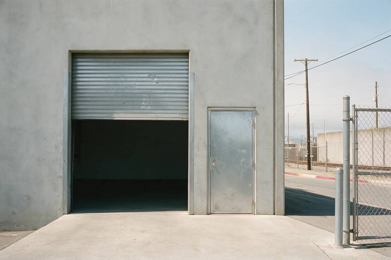 The Roll-Up and the Man-Door: What Each One on a Davis Street Building Actually Needs